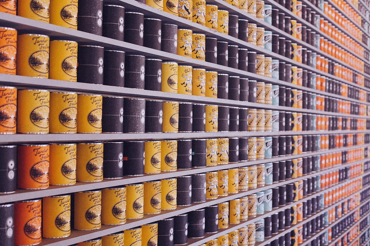 Supermarket shelves stacked with rows of canned food, representing shopping smarter by reading ingredient labels