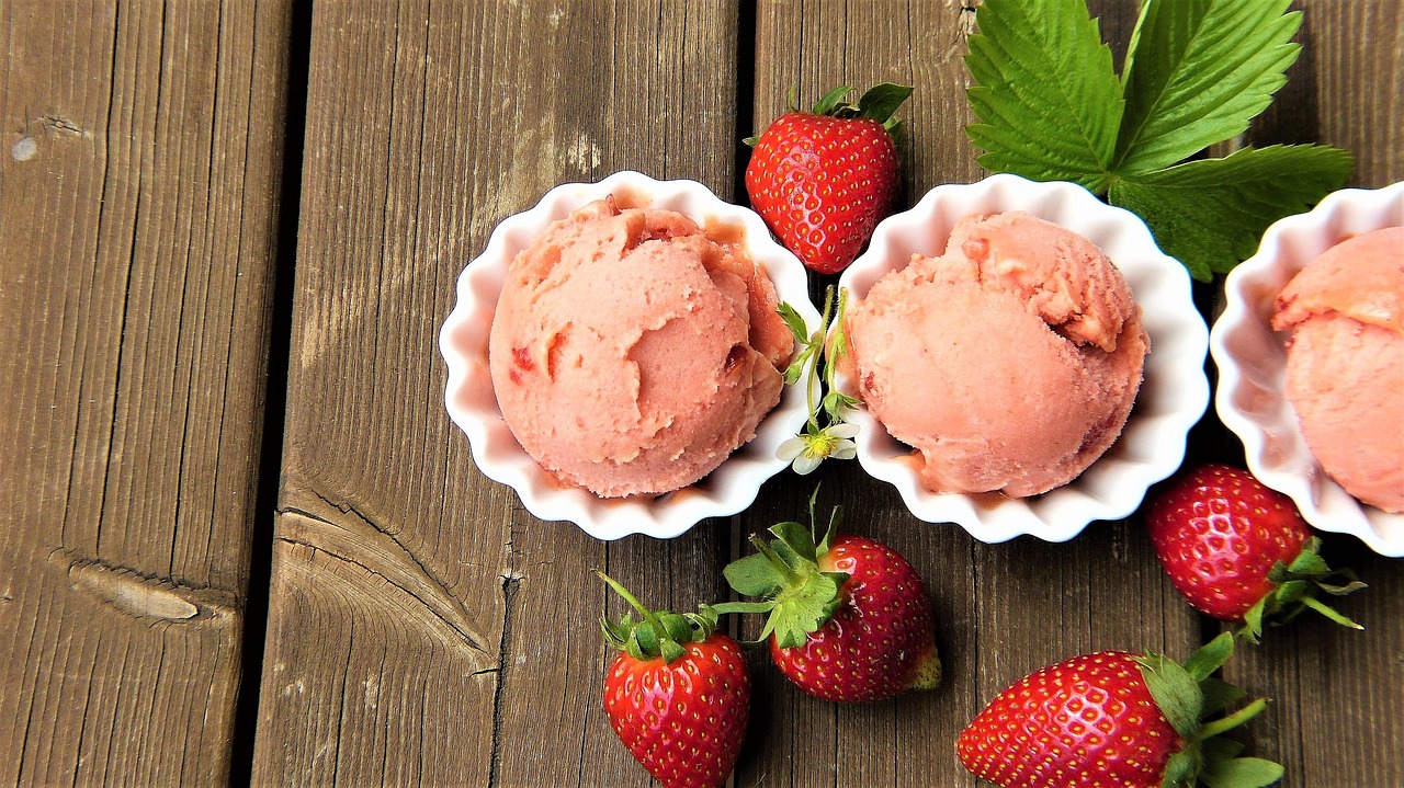 Fresh strawberries and creamy strawberry ice cream in rustic bowls, as vital as understanding ACOG pregnancy sunscreen.