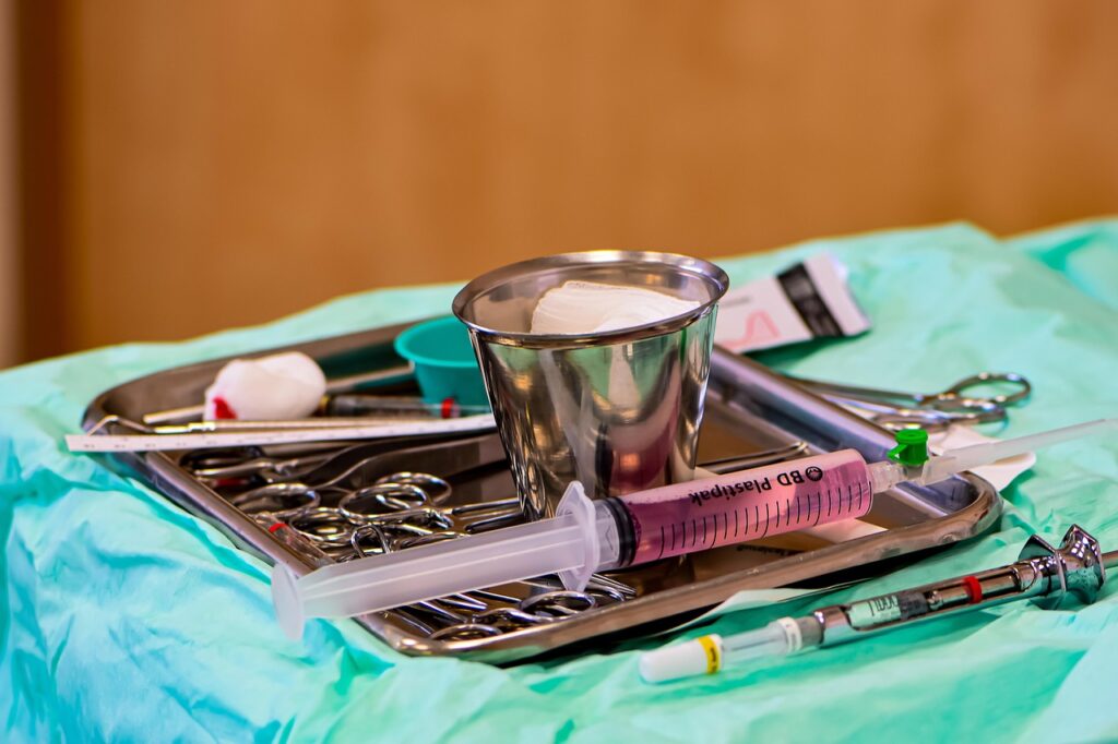 Sterile dental tray with a syringe and instruments laid out for a dental procedure with local anesthetic