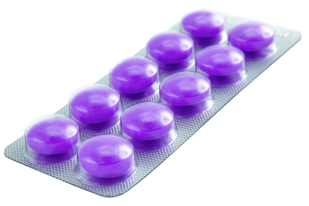 Blister pack of round purple tablets on white background, relevant to Dulcolax laxative use during pregnancy