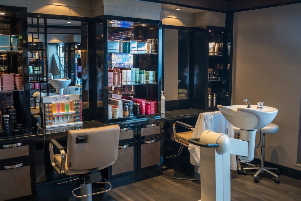 Bright modern hair salon interior with styling chairs and mirrors, representing formaldehyde in hair smoothing treatments