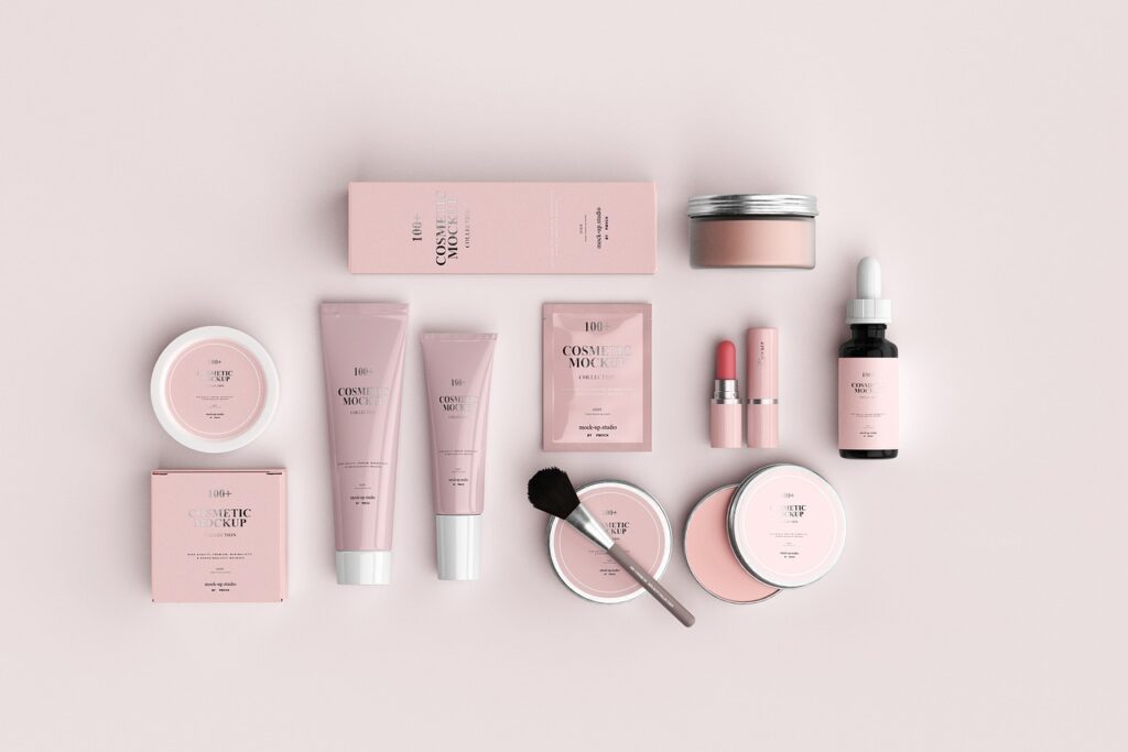 Flat lay of pink cosmetic tubes, jars and serum bottle, representing preservatives in personal care products