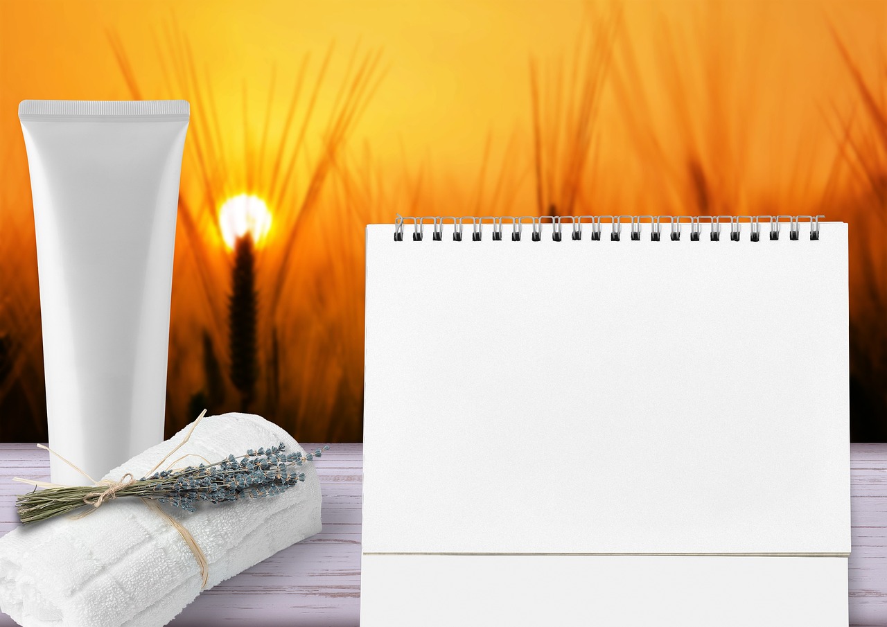 Plain white unbranded cream tube beside a lavender-tied towel at sunset, representing a topical gel or lotion for acne in pregnancy