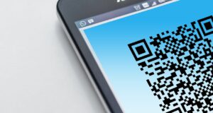 Smartphone screen showing a QR code close up, representing scanning products to check ingredients