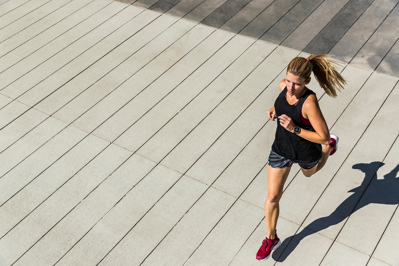 A woman running outdoors, mindful of CeraVe Resurfacing Retinol Serum safety during pregnancy.