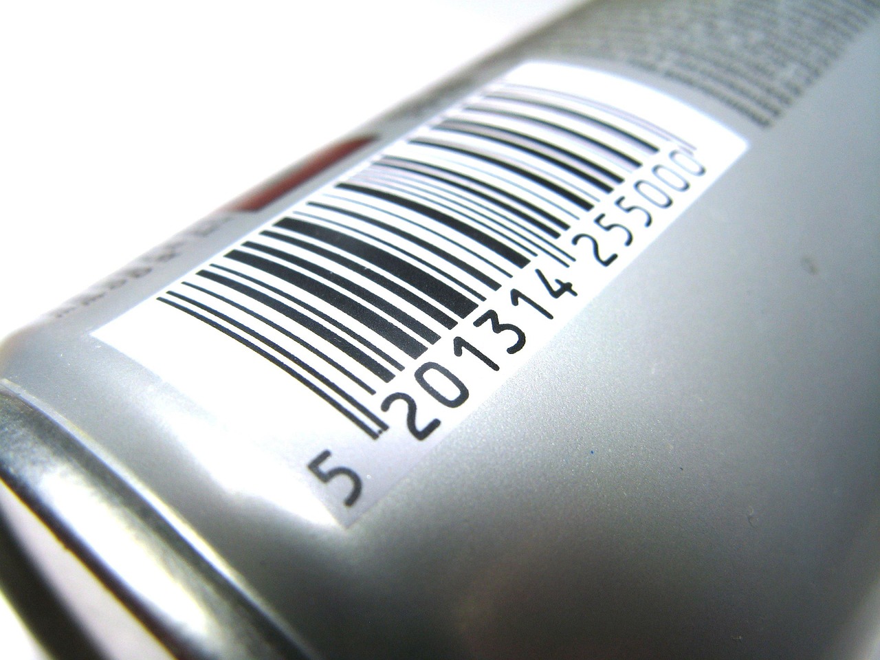 Close-up of a barcode printed on a metal can, representing scanning a product label for accurate info