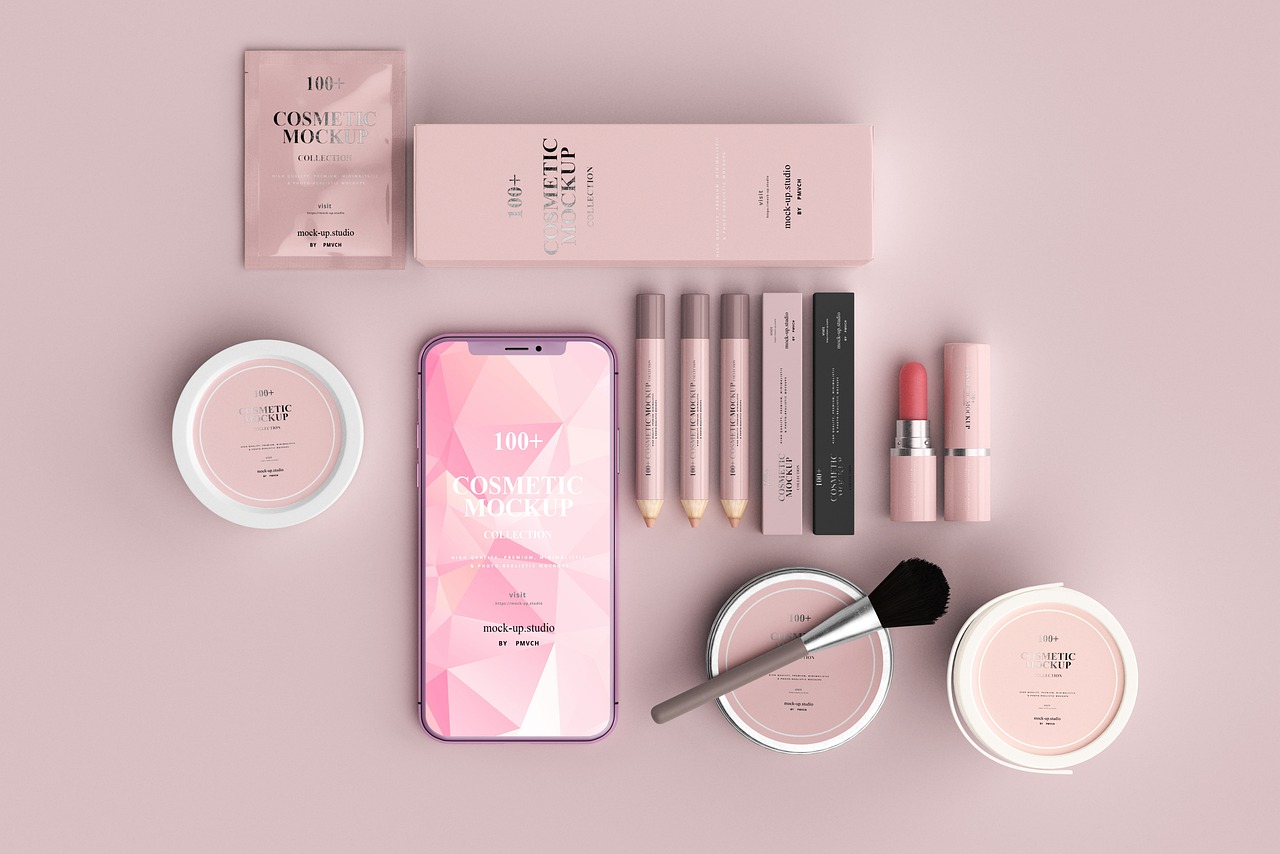 Flat lay of cosmetic jars, lipsticks and a smartphone on a pink background, representing ingredient scanning