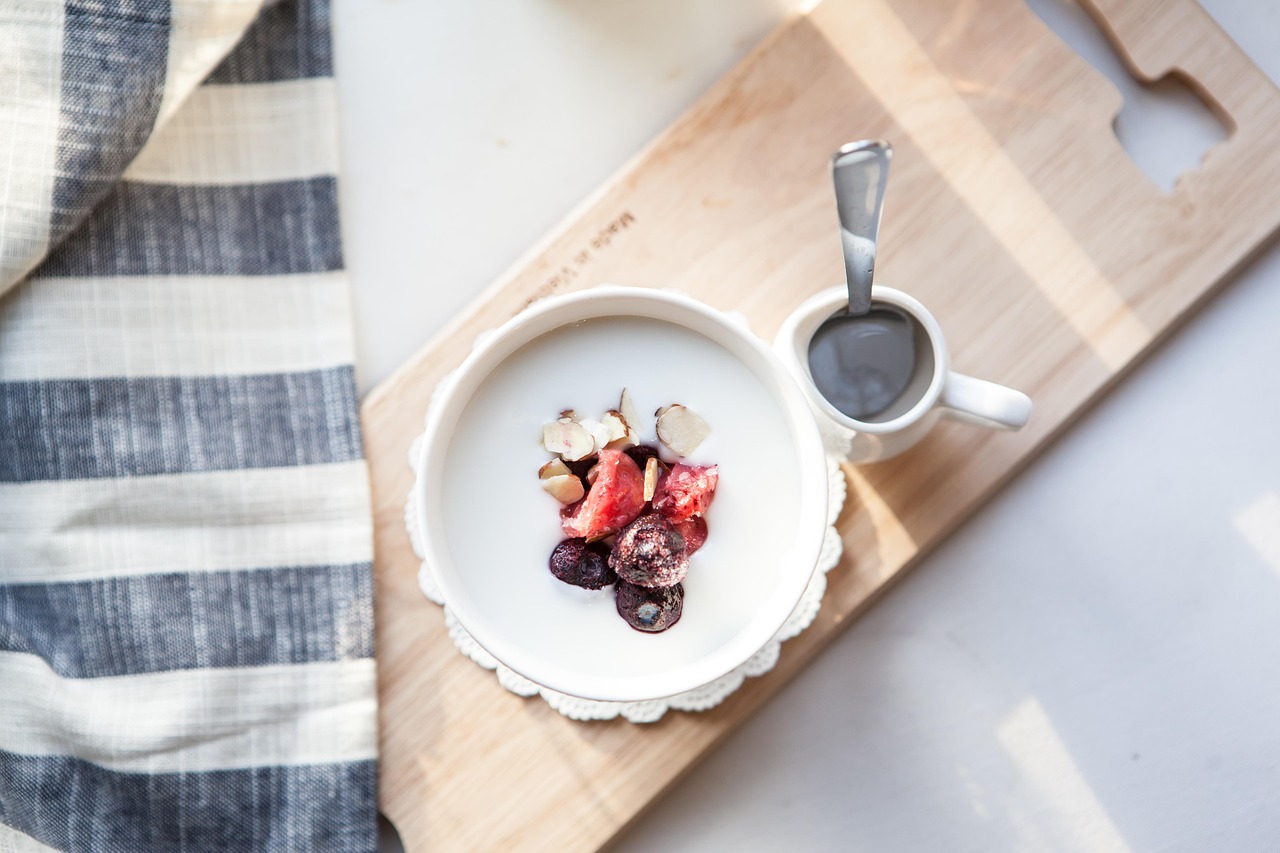 A healthy bowl of Greek yogurt with berries and dried fruit in a cafe, for insights on Greek yogurt during pregnancy.