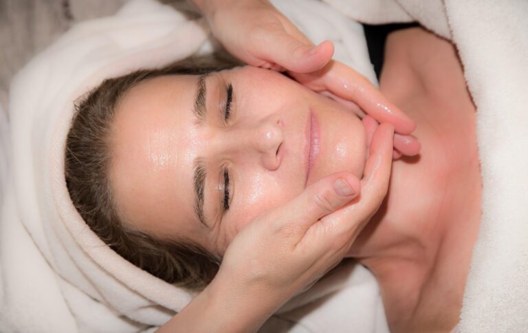 Young woman receiving a relaxing skin treatment, learning about ceramide NP, AP, EOP during pregnancy.