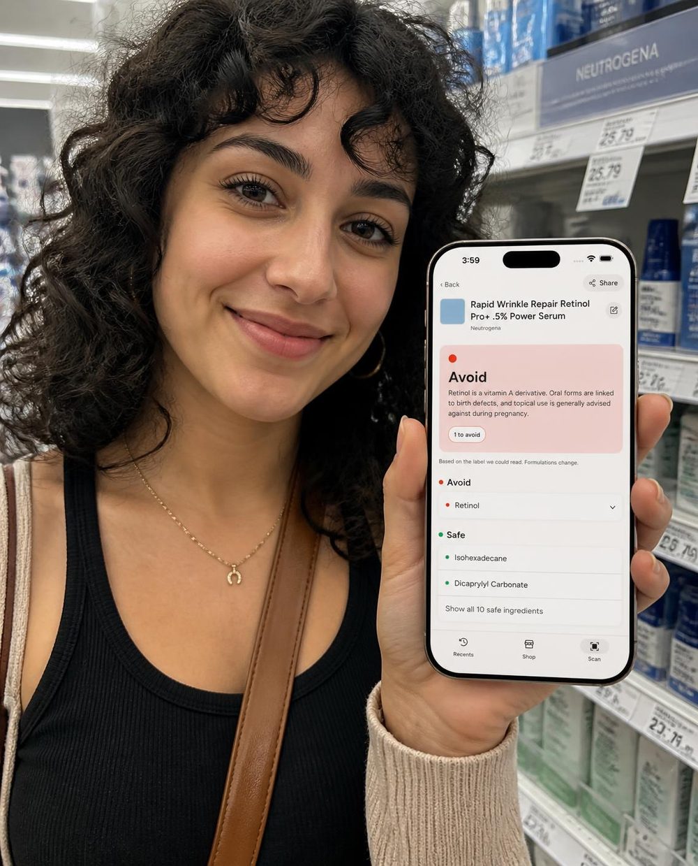 A woman in a pharmacy aisle holding a phone showing an Avoid result
