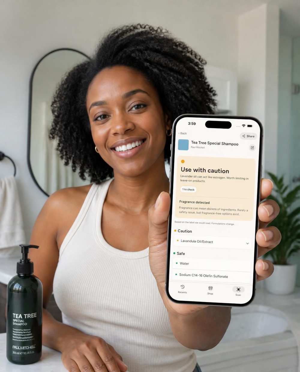 A woman holding a phone showing a SafeMom result
